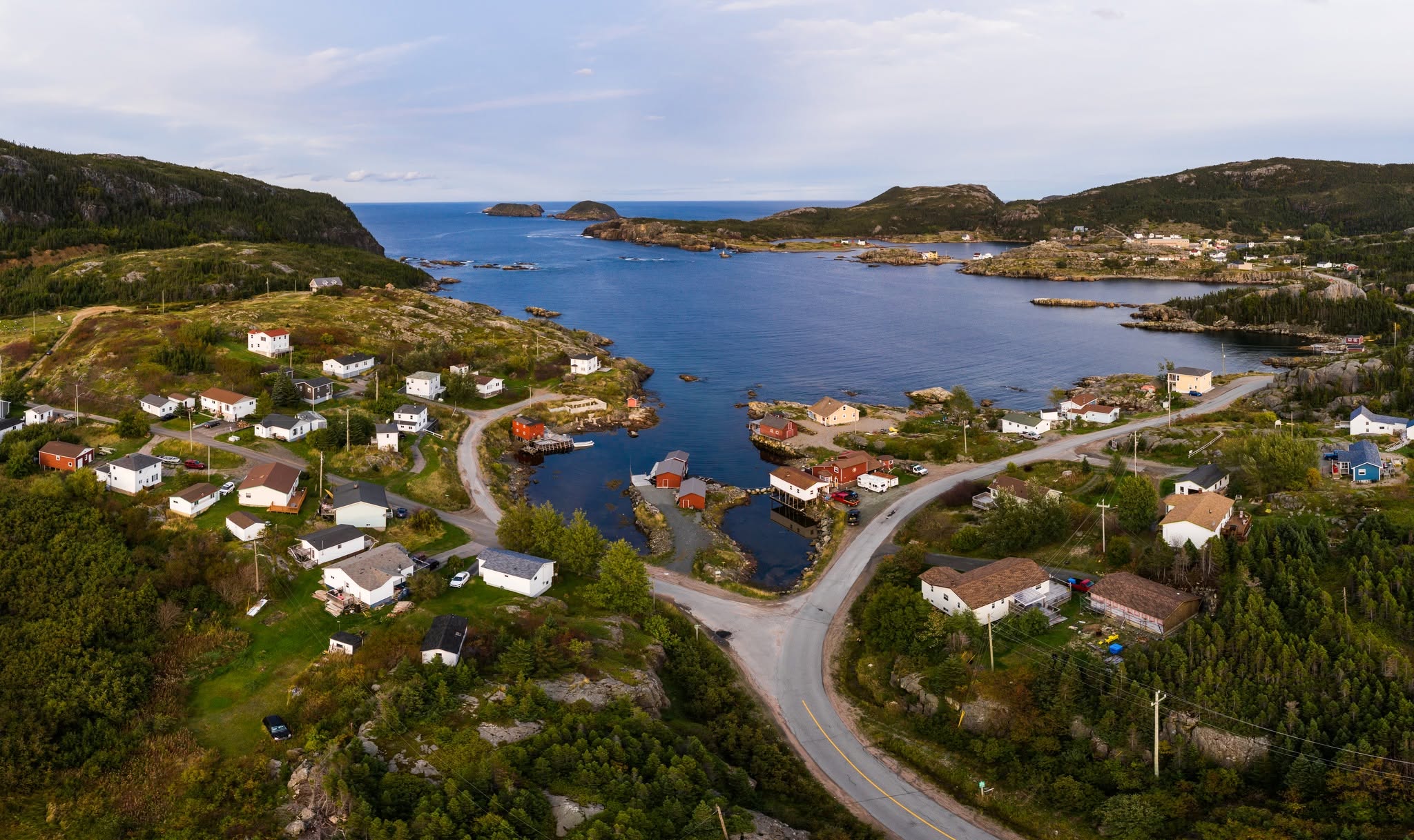 Aerial view of Salvage harbour, roads, houses, and surrounding coastline