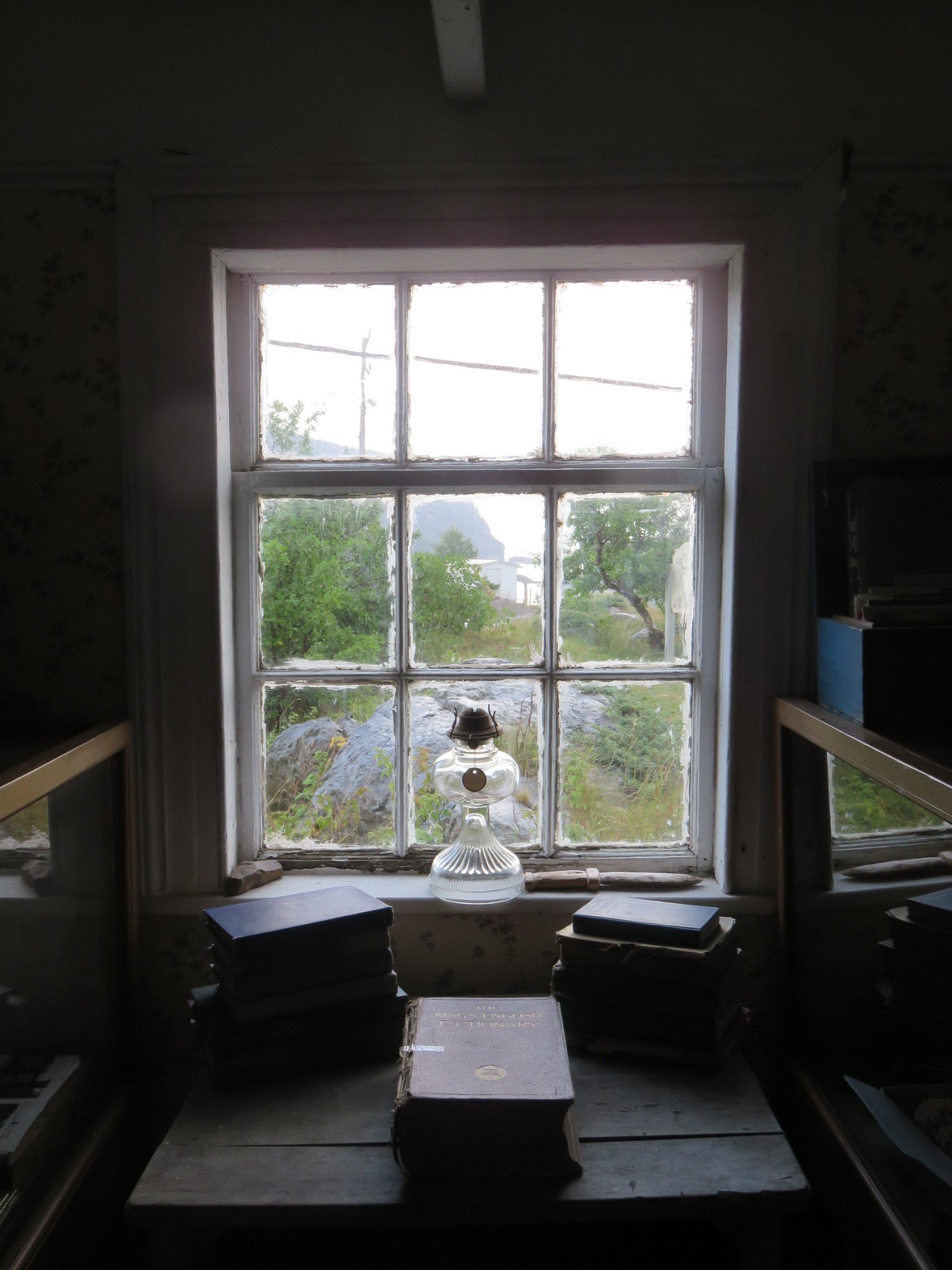 View through a museum window from the main room
